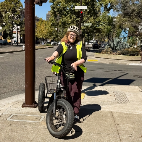 Woman on three-wheeled, fat-tire bicycle